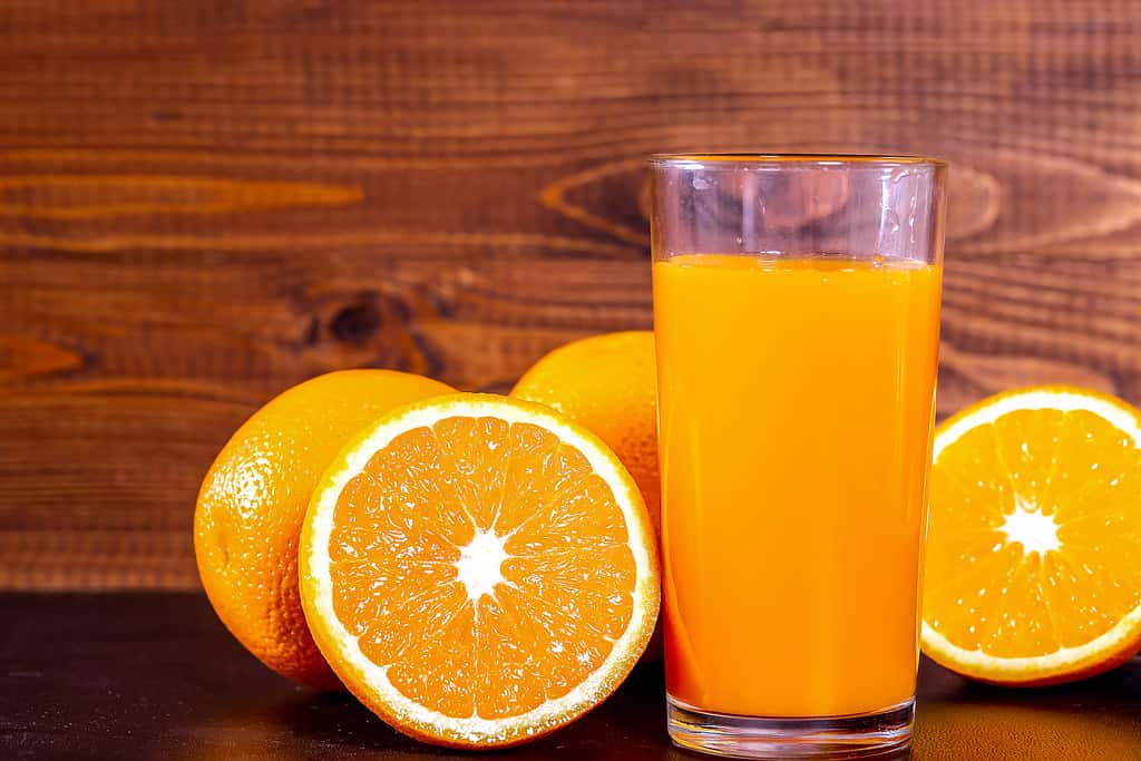 A glass of fresh orange juice with fruit oranges | ✅ Marco V ...